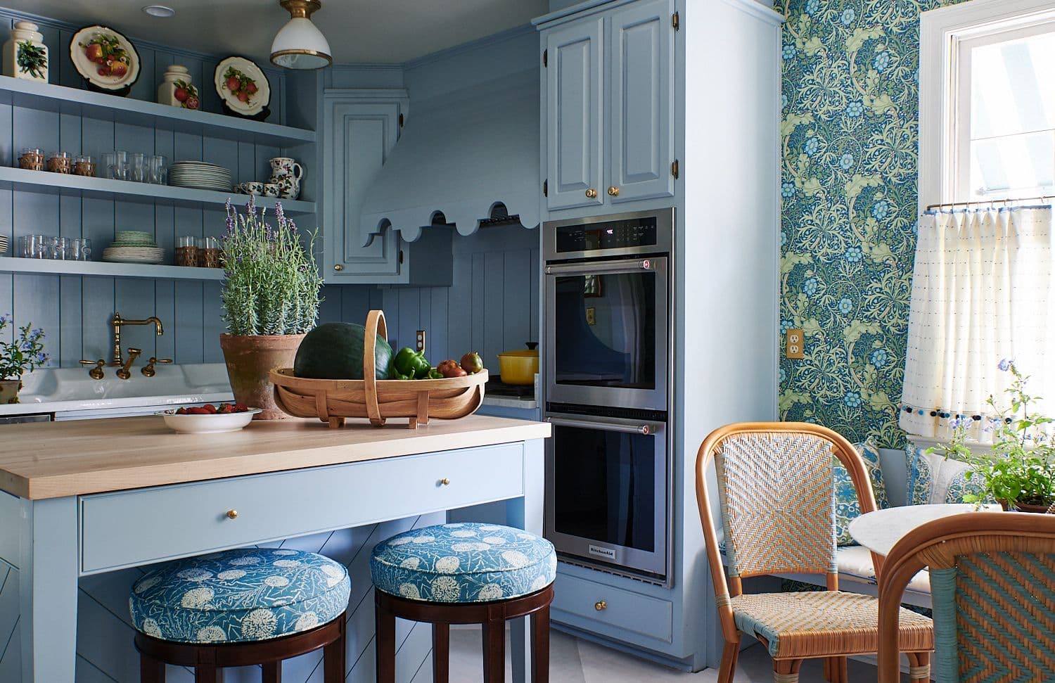 Upholstered round barstools, pleated kitchen drapes