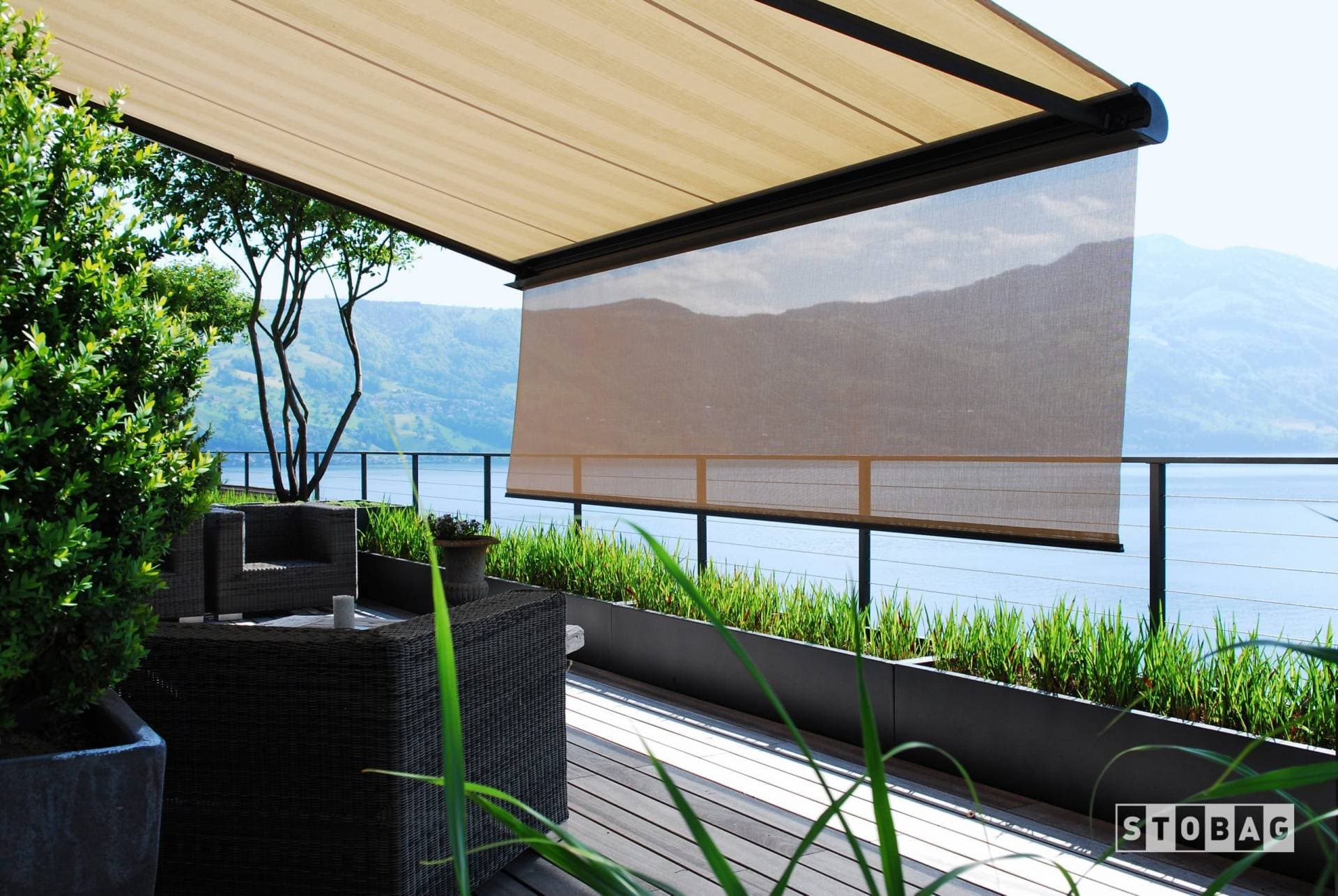 Custom motorized retractable awning with drop down shade
