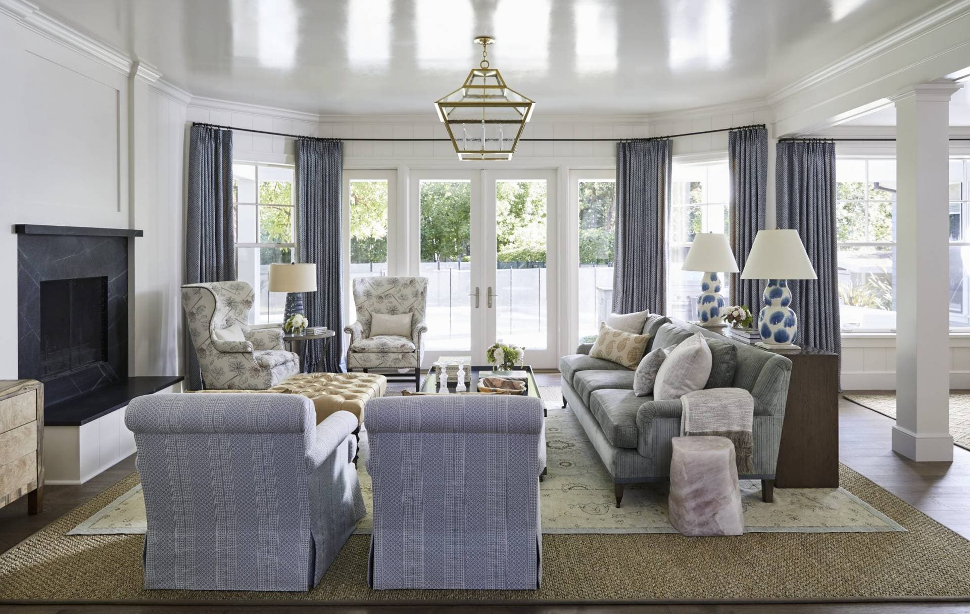Wide view of living room with multiple style upholstered sofas and chairs