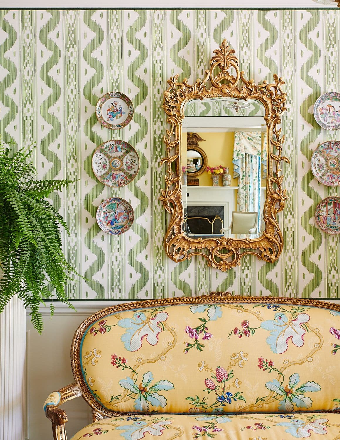 Vibrant floral settee with rivets